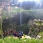 The Baatara Gorge Waterfall is located in Tannourine, Lebanon. The waterfall descends into the Baatara Pothole along the Lebanon Mountain Trail. The water falls behind three bridges and down into a 250 meter chasm.