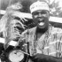 Legendary American boxer Mohammed Ali (Lagos, 1964) in Aso Oke with his gangan drum saying Yòrùbá l'Ọba Yoruba is royalty