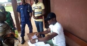 A youth corper distributes pvc ahead of the Edo Governorship election