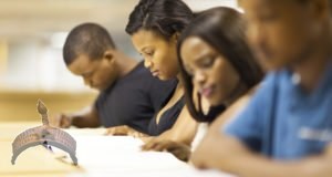 Nigerian college students reading in library