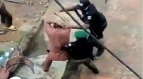 Policemen assaulting a lawyer in Onitsha, Anambra State