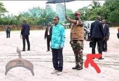 Guinea President umbrella holder removes him from Power