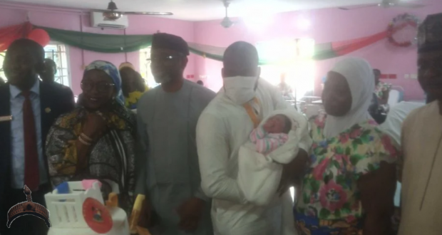 Speaker, House of Reps, Femi Gbajabiamila flanked by the families of the new born